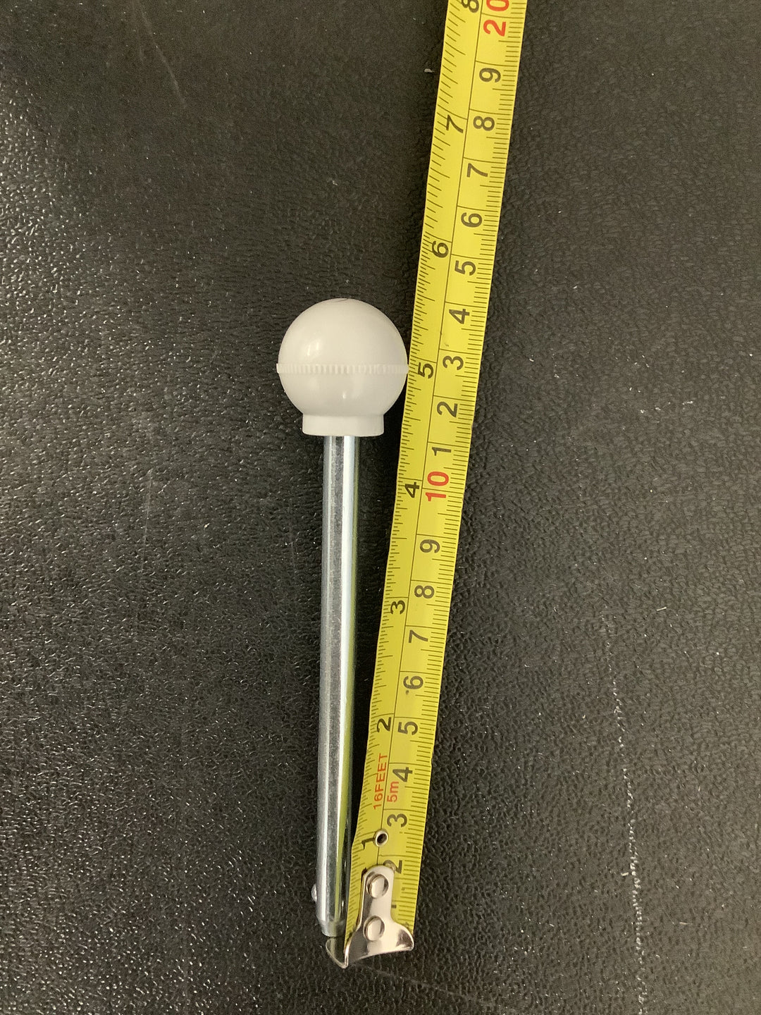 a gym equipment weight stack selector pin with a round ball handle.