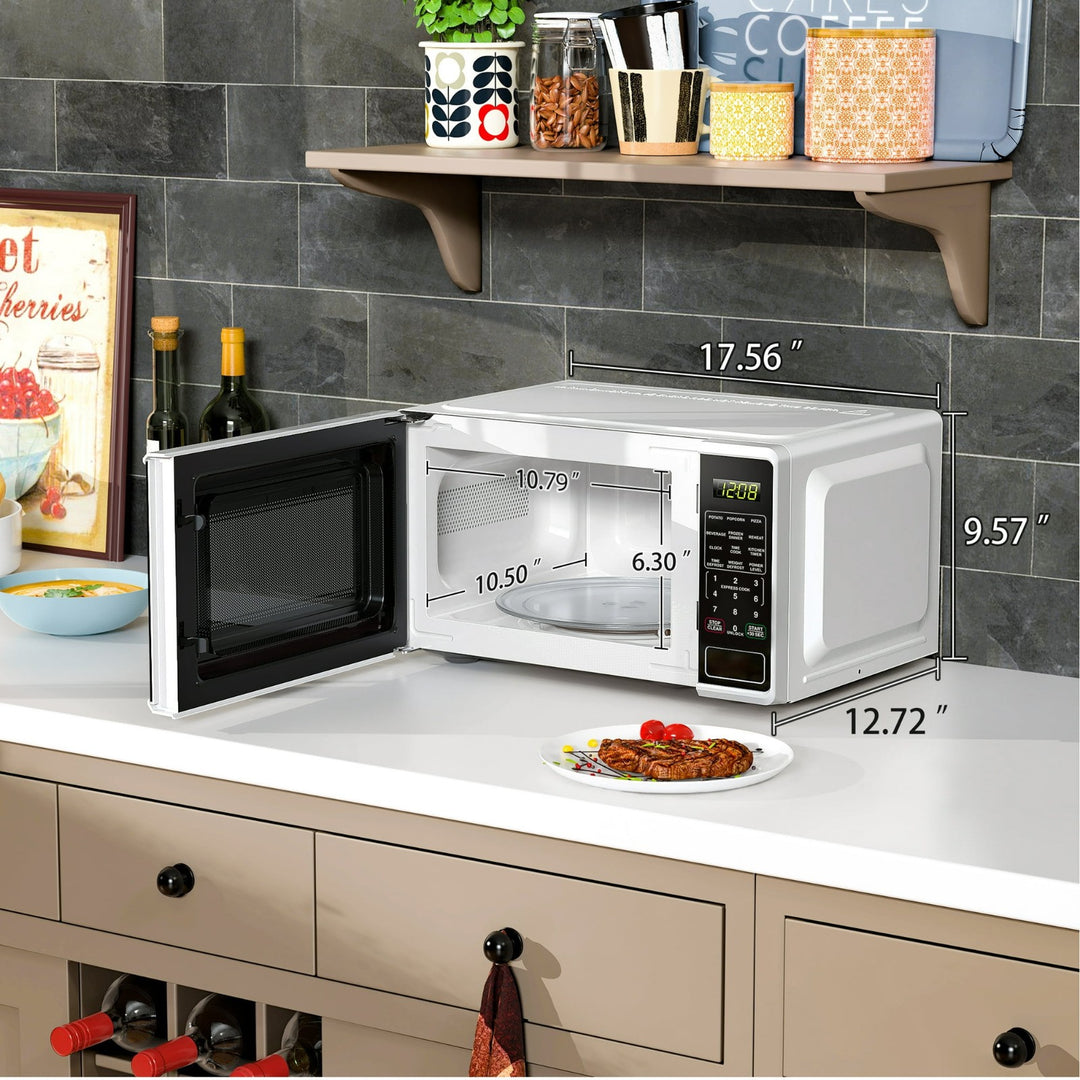 Mainstays 0.7 Cu Ft Countertop Microwave Oven  700 Watts  White Retail $58.00