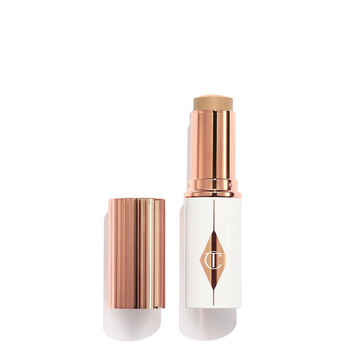 Charlotte Tilbury Unreal Skin Tint & Sheer Glow Hydrating Foundation Stick - Cream Foundation Makeup with Sheer-to-Light Coverage & a Buildable Formula - Blurring, Smoothing & Nourishing - 5 Medium