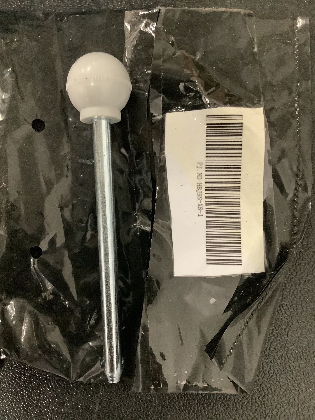 a gym equipment weight stack selector pin with a round ball handle.