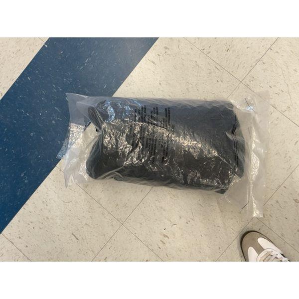Black Puffer Jacket in Plastic Packaging Retail $15.00