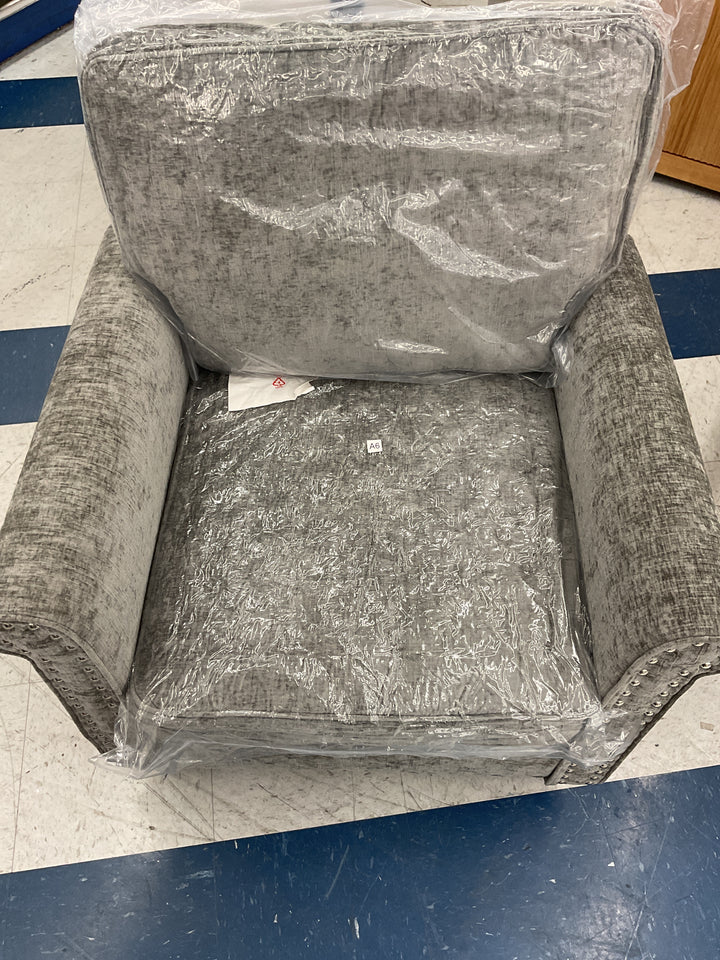 Gray rolled-arm accent chairs with nailhead trim and turned wooden legs