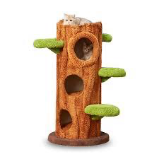 fairy-forest style tree trunk cat tower condo. It features a realistic faux-bark texture wrapped around a multi-level activity cylinder with cubbyholes, steps, and green mossy plush perches designed to bring an enchanted nature theme into your home.